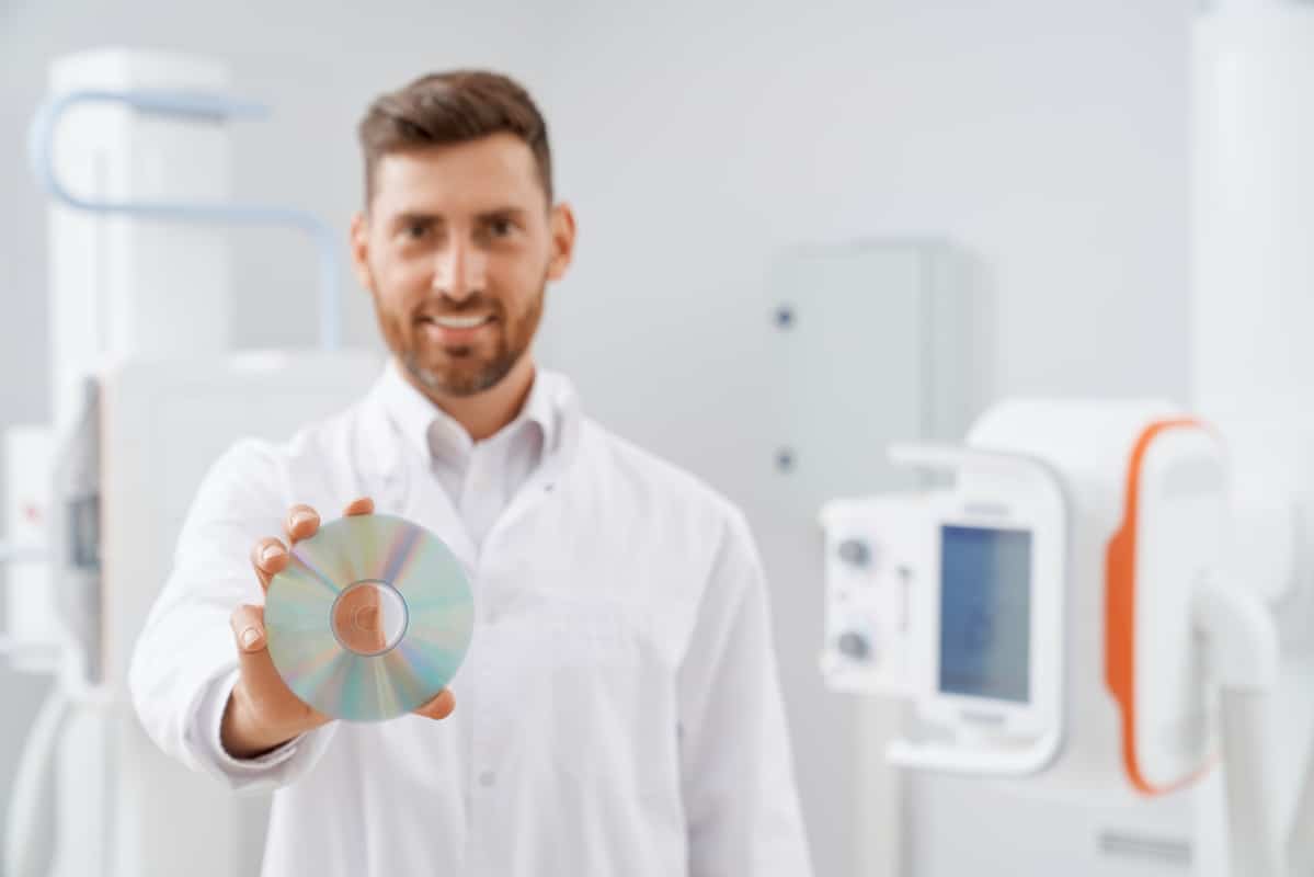 CD printing doctor giving documents on CD